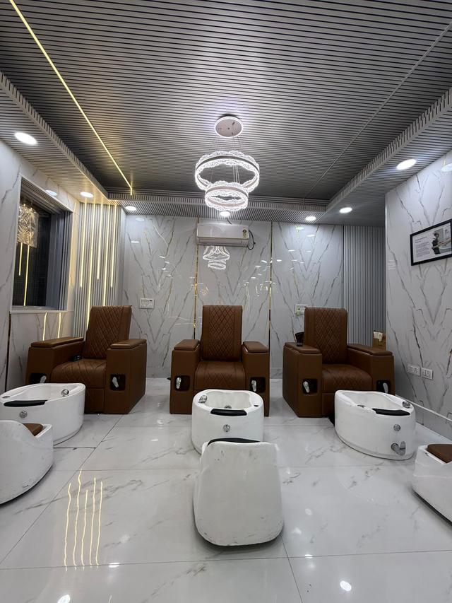 Pedicure lounge with massage recliners and spa foot tubs for manicures, pedicures and relaxing foot care